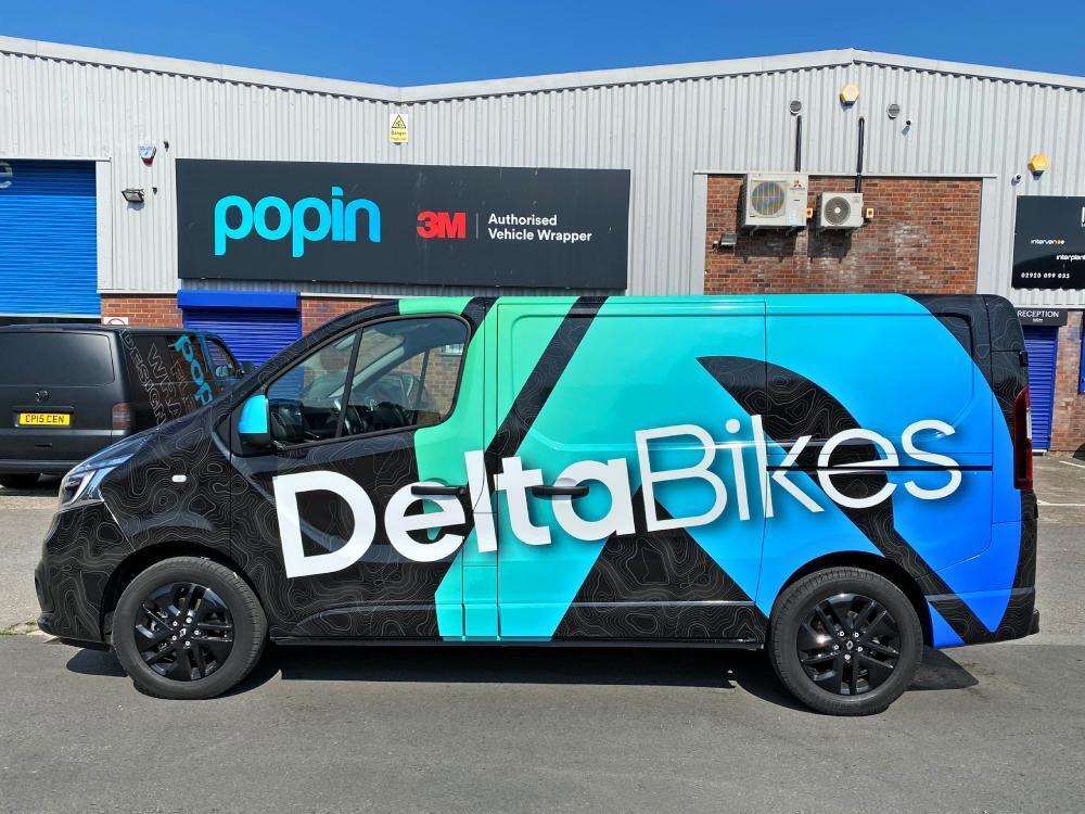 Van wrap on Renault Trafic company vehicle.