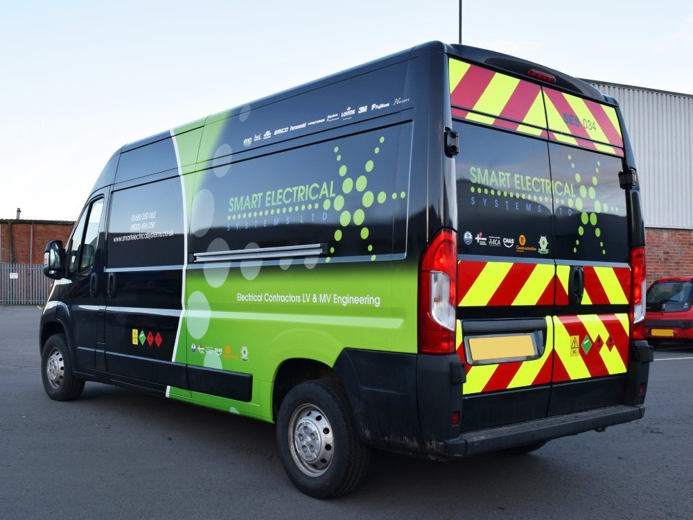 Company branded van wrap and rear chevron graphics on Peugeot Boxer.
