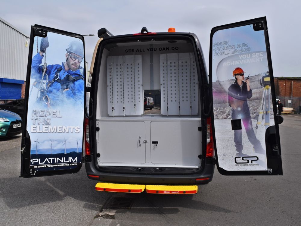 Vinyl graphics installed on inside of rear doors of Mercedes Sprinter.