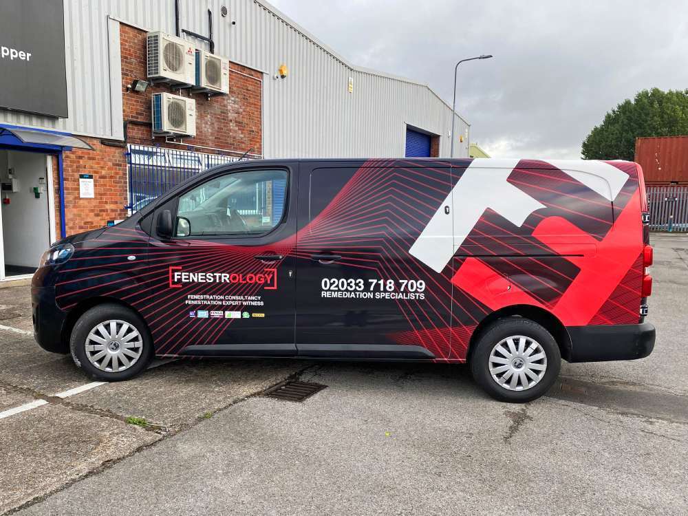 Red van wrap on company Vauxhall Vivaro vehicle.