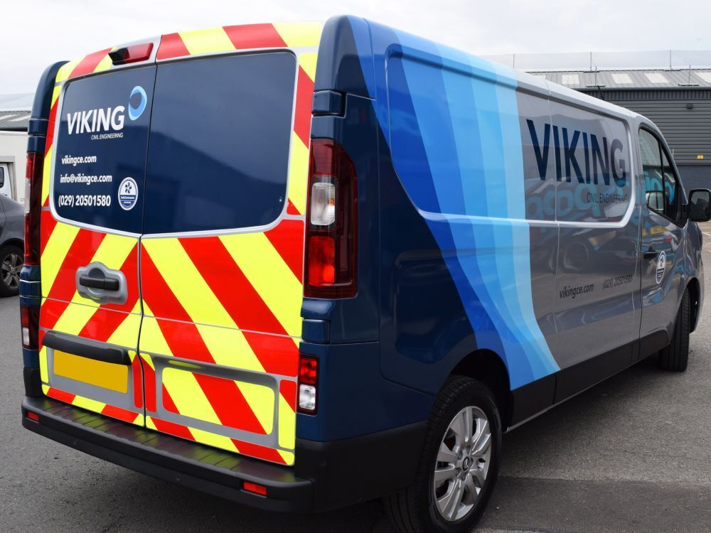 Rear chevron Chapter 8 vinyl graphics on Nissan NV300 company van.