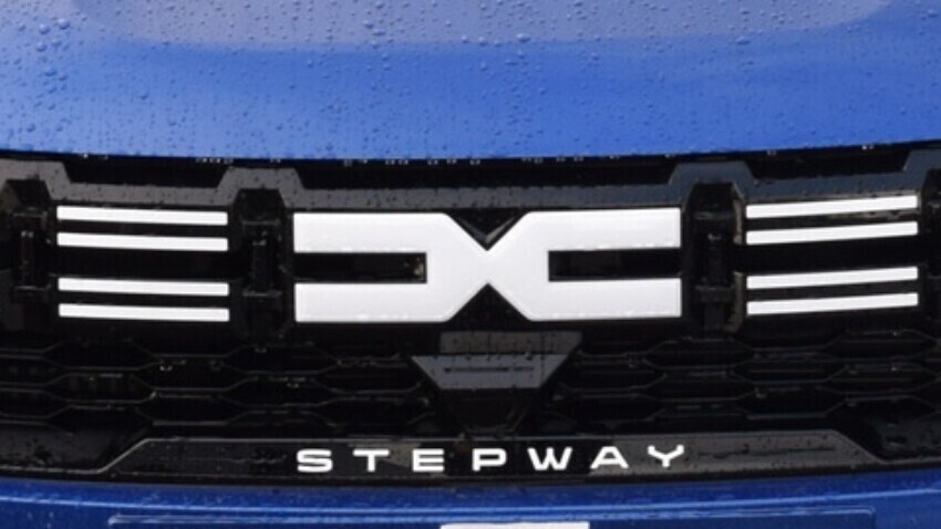 Dacia badge on a blue company car.