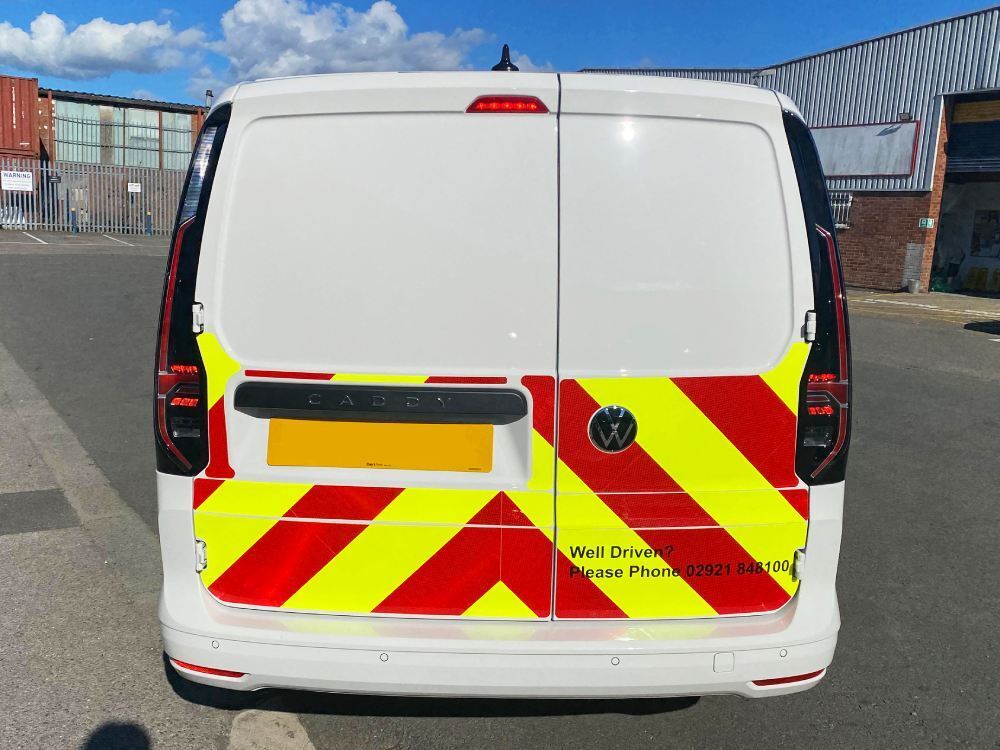 Chapter 8 Chevron vinyl graphics on back of NHS Volkswagen Caddy van.