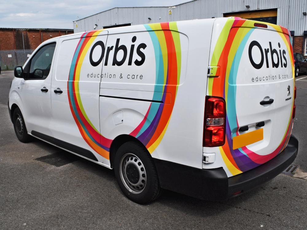 White Orbis company Peugeot Expert with partial van wrap.