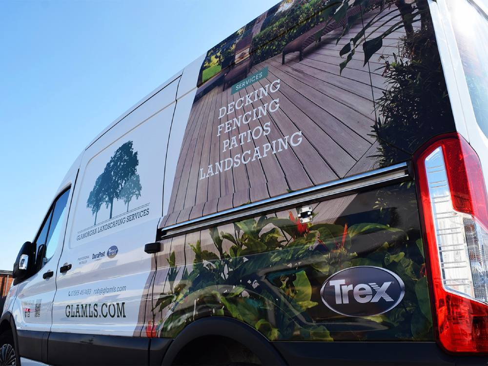 Partial wrap on a Ford Transit van for company branding.