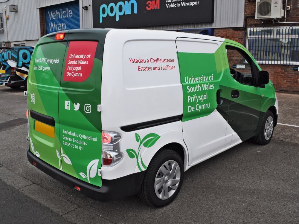 University of South Wales van wrap on Nissan enV200 outside Popin in Cardiff.