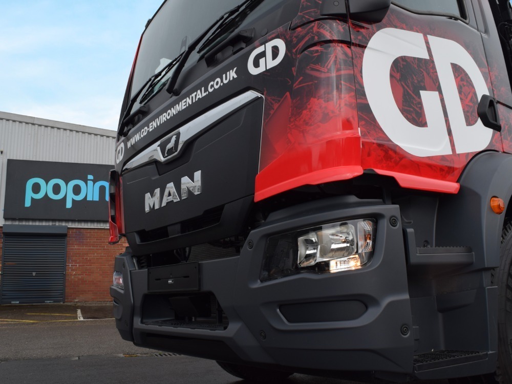 MAN truck outside Popin in Cardiff with new black and red vehicle livery.