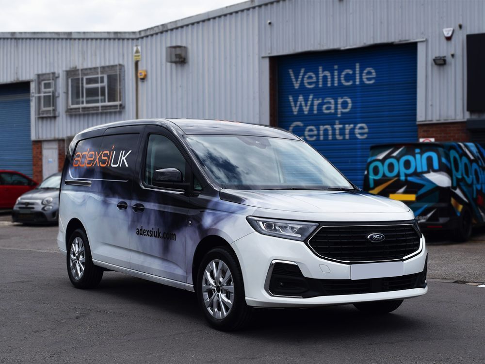 Full branded vehicle livery on a company Ford Transit Connect van.