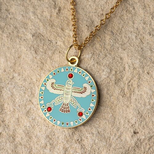 Round Pendant. The Persian Falcon.  Blue Turquoise with 3 Red Stones.