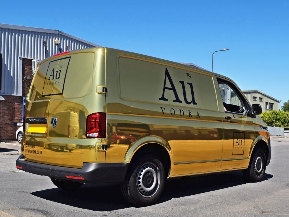 Gold chrome Au Vodka company branded van wrap on Volkswagen Transporter.