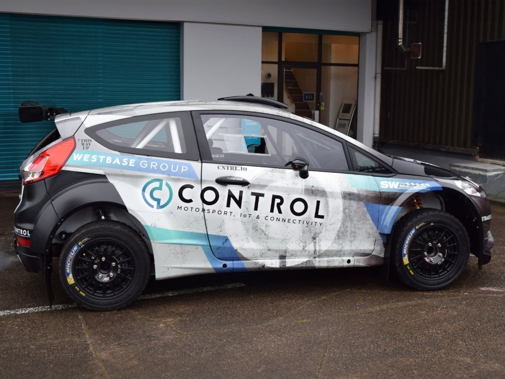 Commercial vehicle wrap on Ford Fiesta R5 company car.