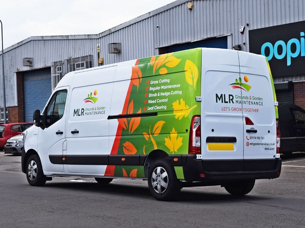 White company Renault Master van with partial wrap and vinyl graphics
