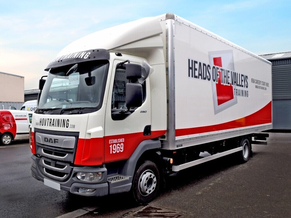 White and red truck wrap on a DAF HGV lorry.