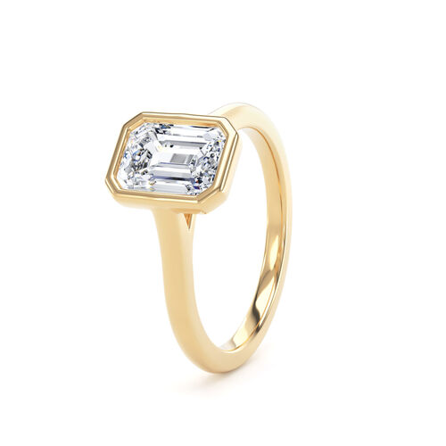 Emerald cut rubover diamond solitaire