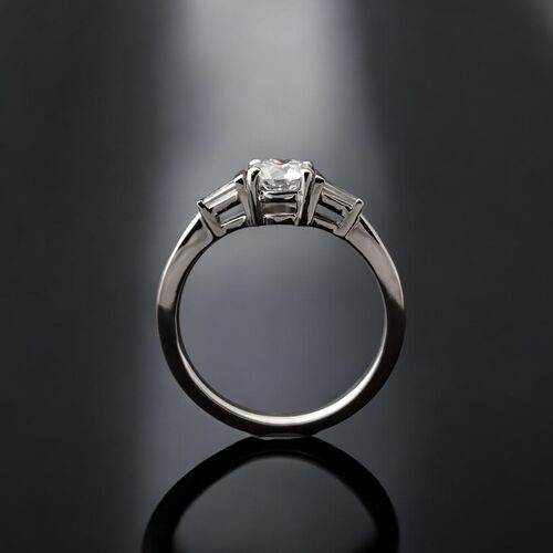 Round diamond and tapered baguette trilogy ring
