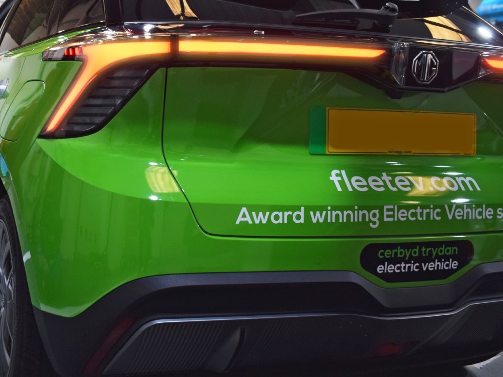 Green rear partial wrap on MG4 Trophy EV company car.