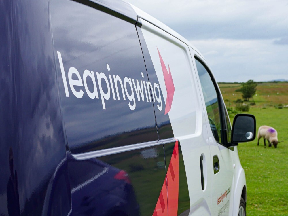 Leaping Wing vehicle livery on Nissan enV200 van.
