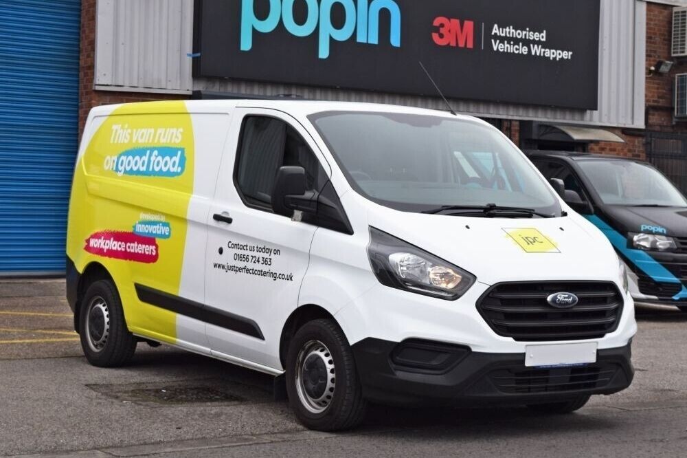 Partial wrap on a company Ford Transit Custom van outside Popin in Cardiff.