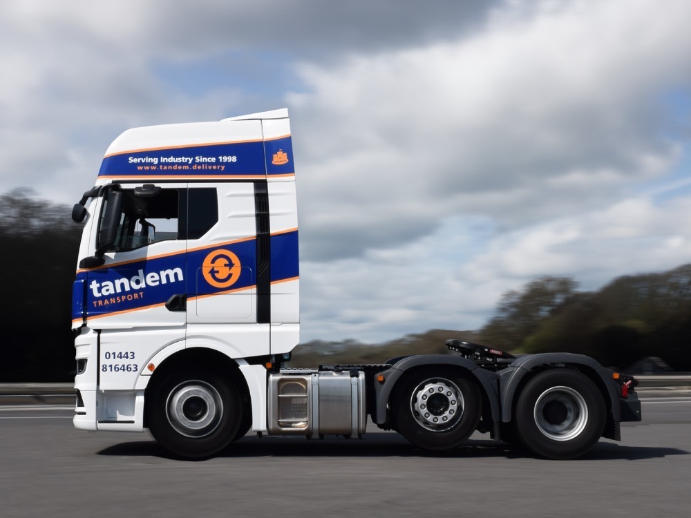 Branded vinyl graphics on a MAN truck.