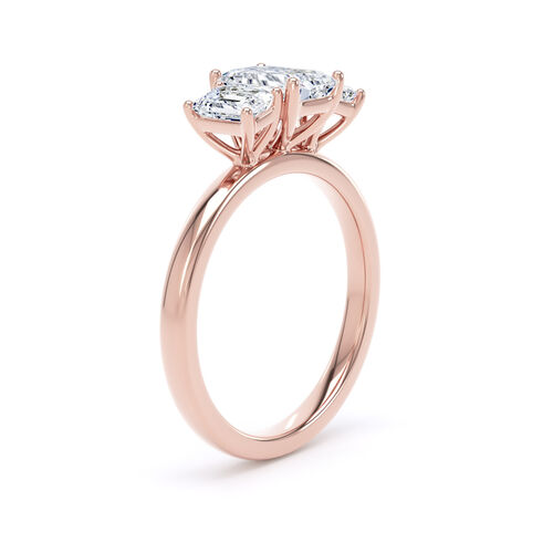 Emerald cut diamond trilogy ring