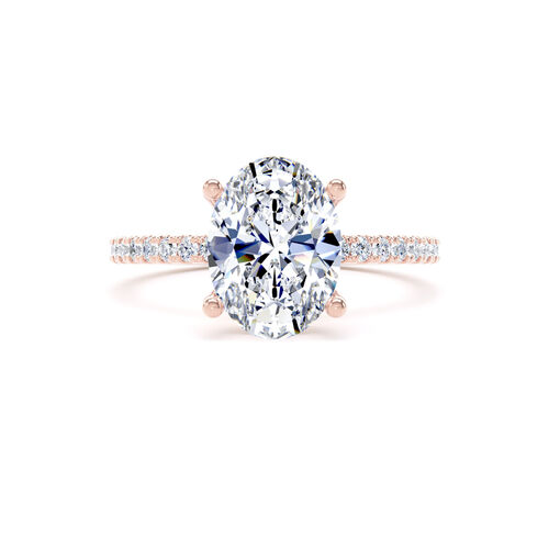 Oval solitaire with diamond set shoulders and hidden diamond detail