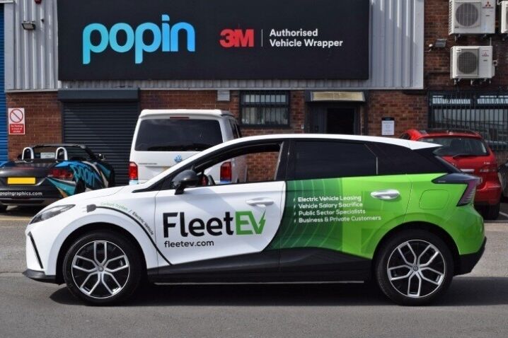 MG4 Trophy EV company car with green credentials branded partial vehicle wrap and vinyl graphics outside Popin in Cardiff.