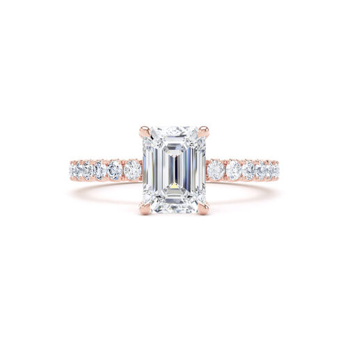 Emerald cut solitaire with diamond set shoulders