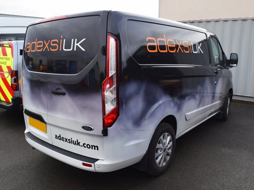 Branded company vehicle wrap on a Ford Transit Custom van.
