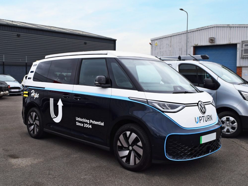 Volkswagen ID. Buzz with partial branded company van wrap.