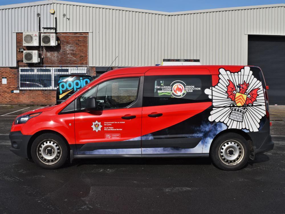 Partial vehicle wrap on South Wales Fire and Rescue Services branded Ford Connect van.
