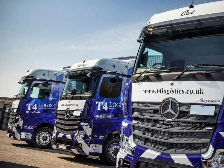 Lorry fleet with matching vehicle wraps.