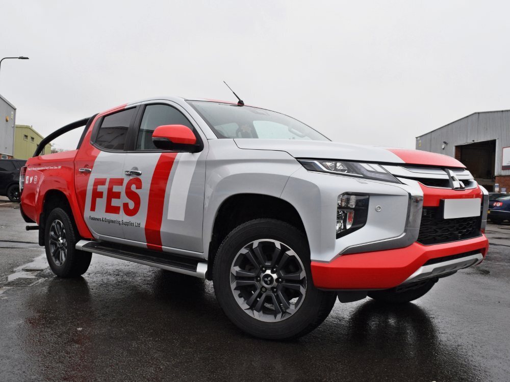 Mitsubishi L200 with company branded vehicle wrap.