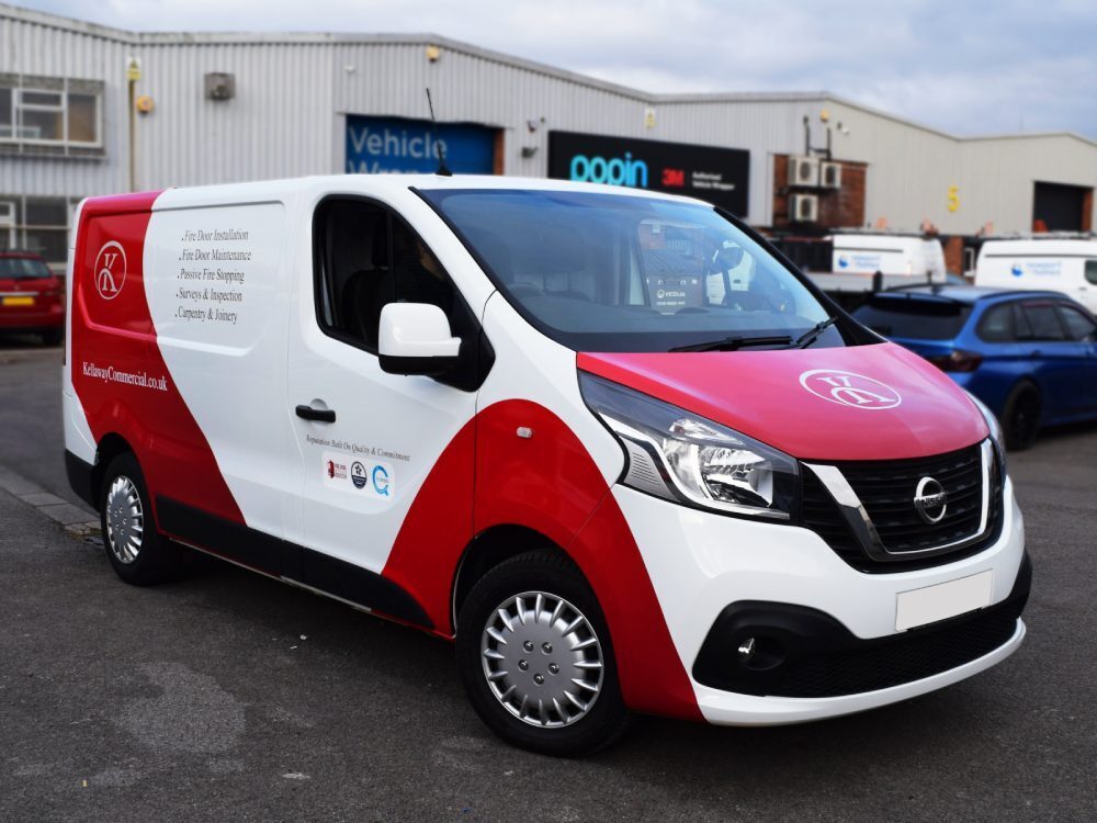 Red and white company branded van wrap on Nissan NV300.