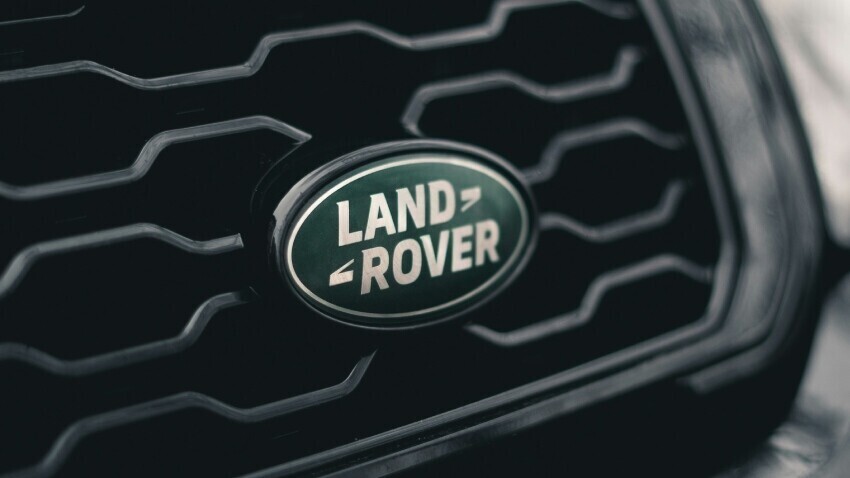 Land Rover badge on vehicle grille.