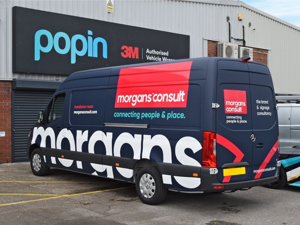 Morgans Consult branded vehicle wrap on company Mercedes Sprinter van outside Popin in Cardiff.