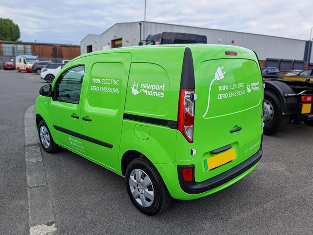 Electric Renault Kangoo van with green full vehicle wrap.