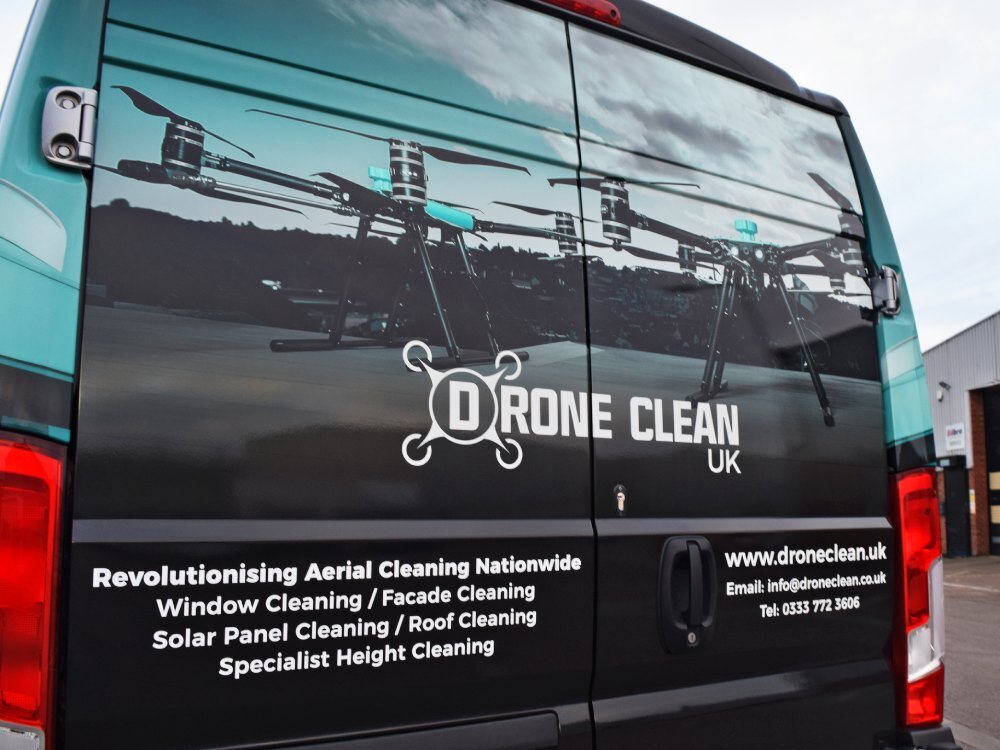 Van wrap with imagery on rear of company Peugeot Boxer.