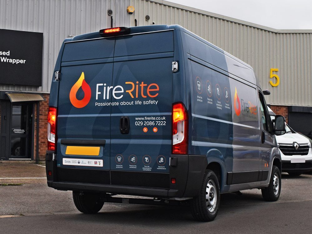 Smart van wrap on rear end of a company Vauxhall Movano.