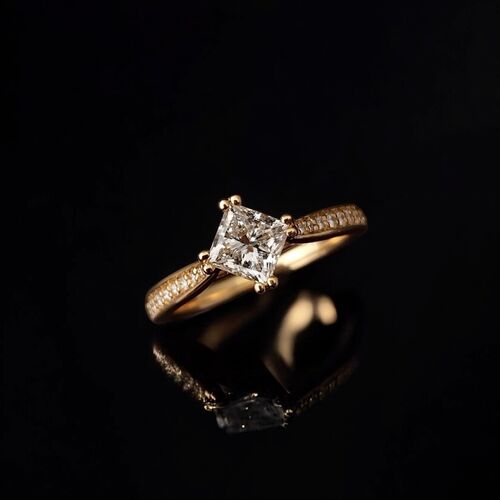 Princess cut double claw solitaire with diamond set shoulders 