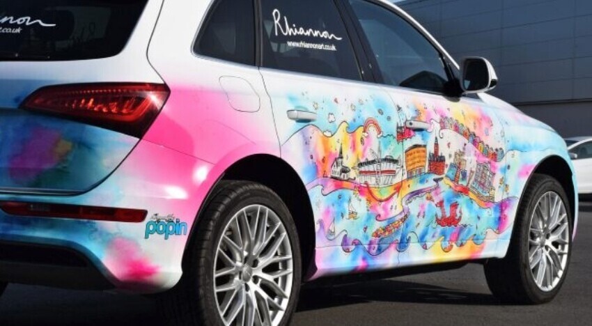 Creative custom branded car wrap on a company owned Audi Q5.