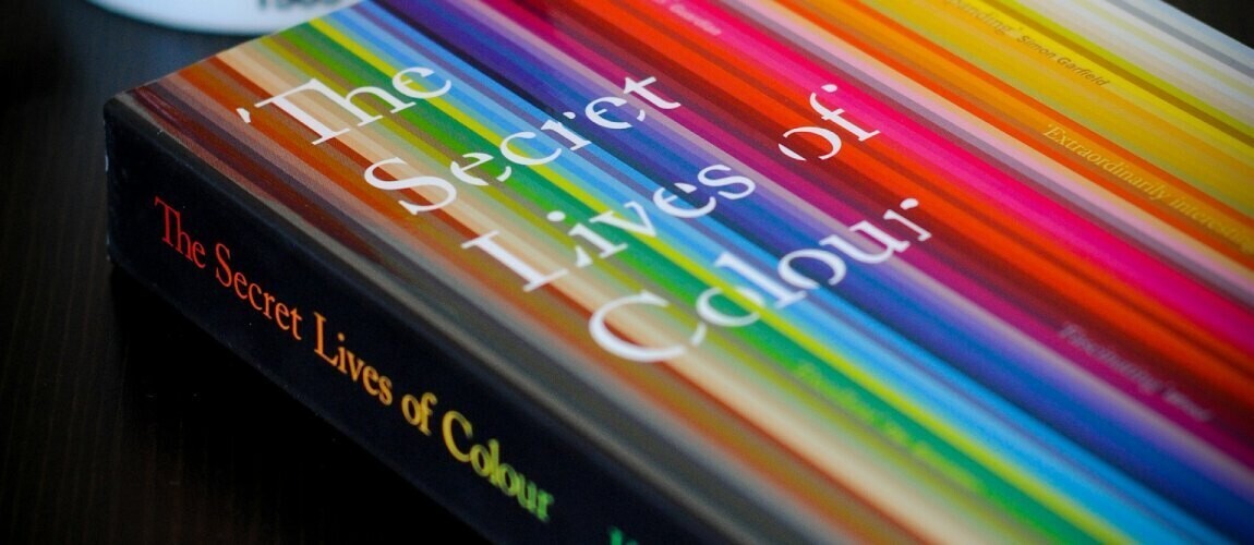 The secret lives of colour book on a table.