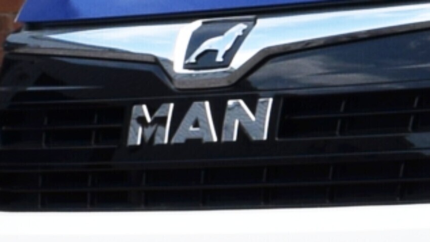 MAN emblem on the front of a van.