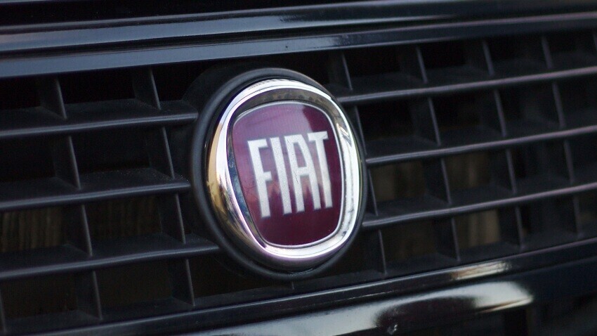 Fiat emblem on front of company van.