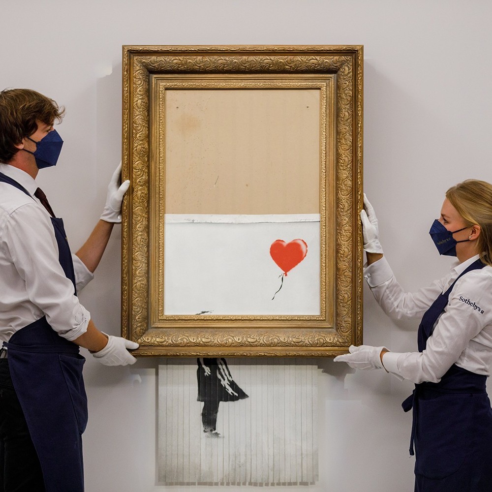 Banksy painting that shredded itself at auction sells again – but this time for more than £18m