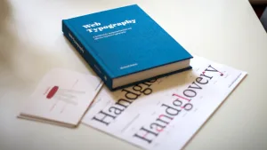 Web Typography next to letter-pressed postcards of the 'typography stool'.