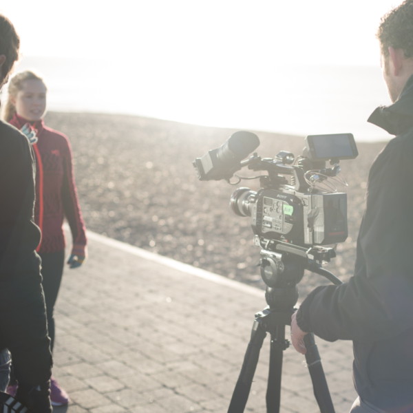 A film crew with an actress on Brighton beach