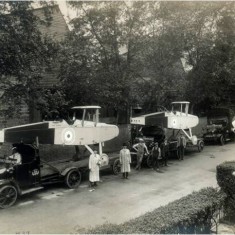 DH9 bombers on trucks outside the factory ready for delivery outside the Alliance Aeroplane Company Ltd, Cambridge Grove. | Hammersmith and Fulham Archives