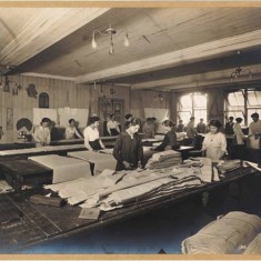 Women factory workers cutting cloth at Waring & Gillow’s White City factory, 1914-1918. | City of Westminster Archive Centre