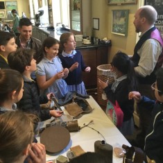 Children looking at artefacts from the First World War | Westminster Archives
