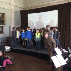 Children from the audience join the soldiers as they prepare to 'go over the top' to fight | Westminster Archives
